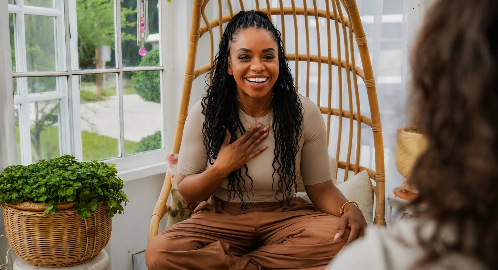 Tatyana, licensed therapist and founder of The Book Sanctuary, in conversation in a sunlit room